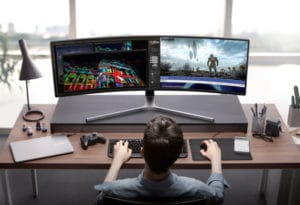 Stock photo of person infront ultrawide monitor