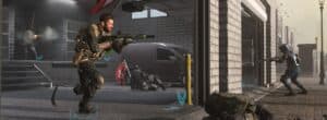 call of duty soldier runs soldier on ground in open garage with gunfire