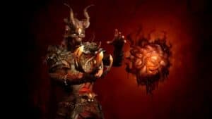 diablo 4 season 1 character stands with floating malignant heart in red background