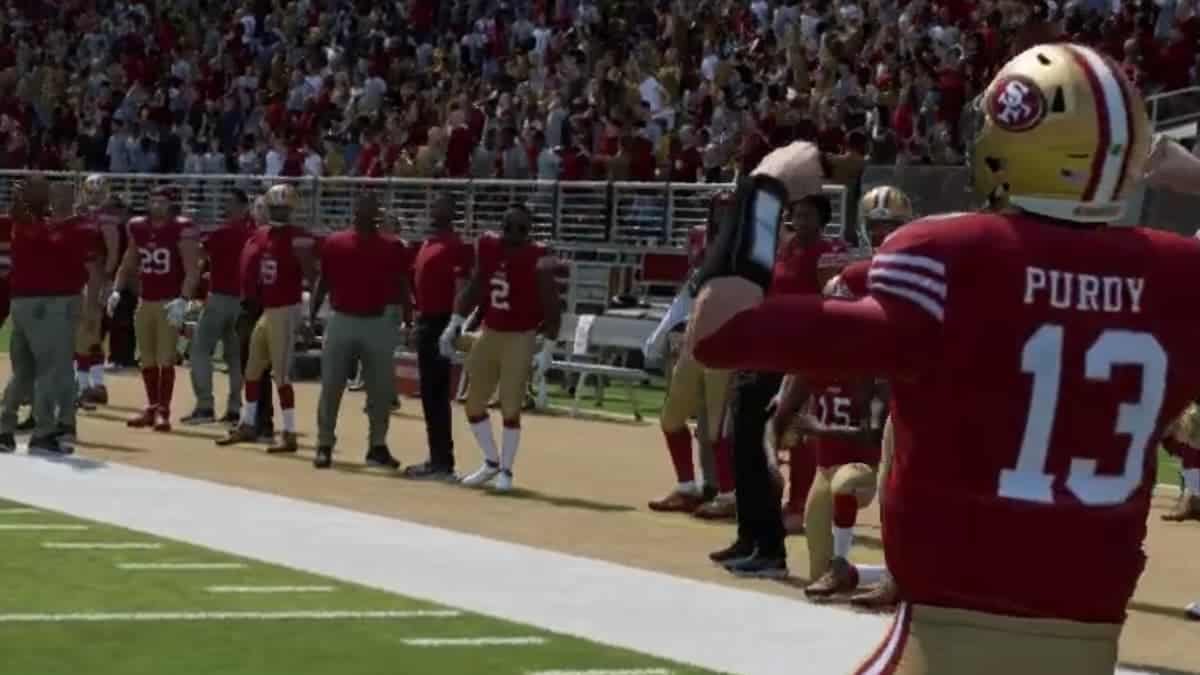 The San Francisco 49ers player is standing on the field for review.