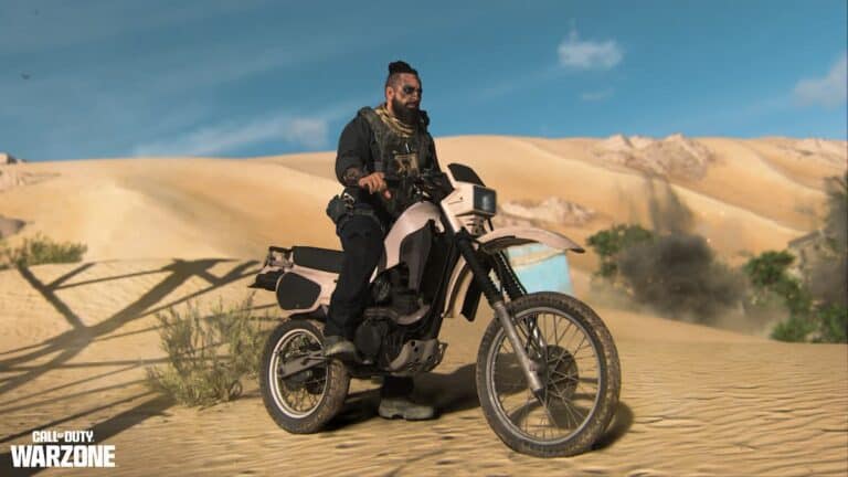 mw2 operator with beard and black outfit on dirt bike in sand dunes at daytime