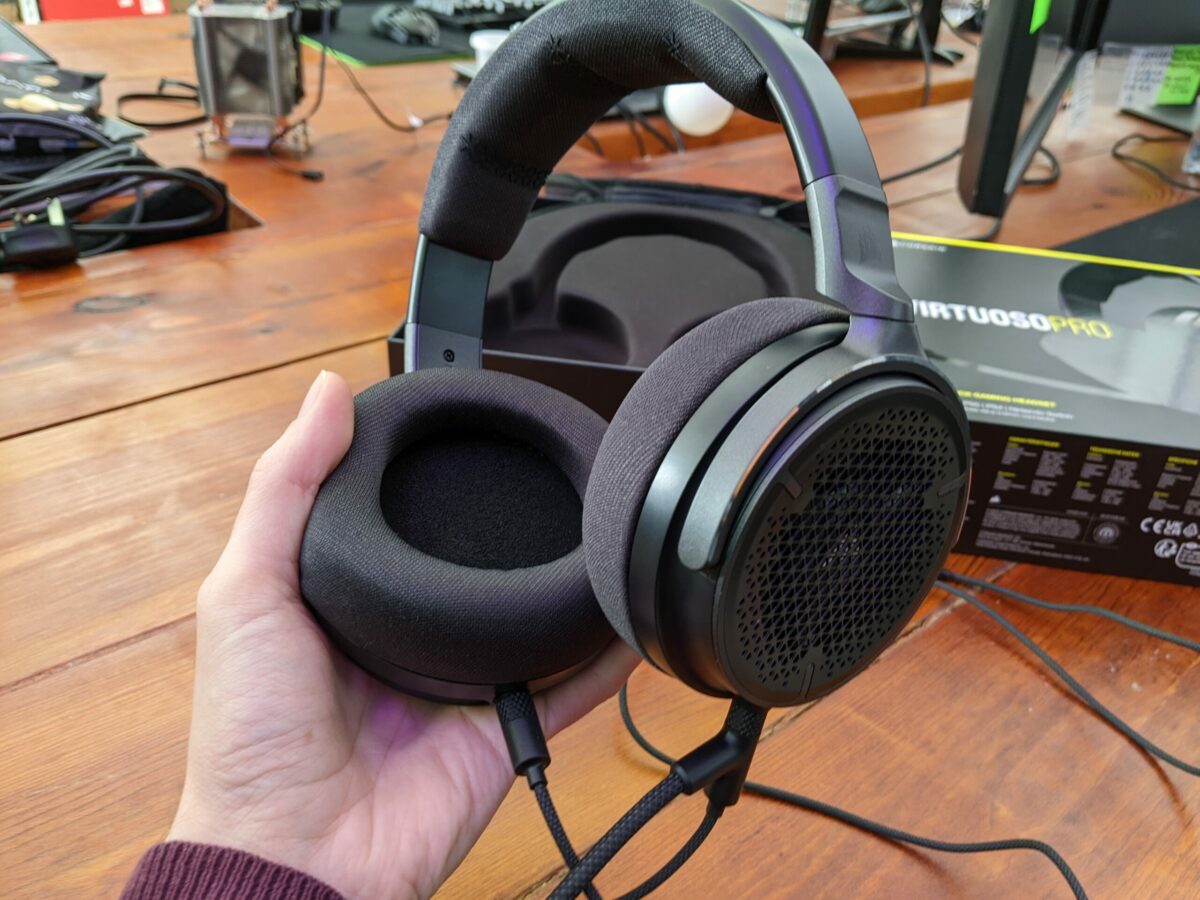 Holding Corsair Virtuoso Pro with mic attached