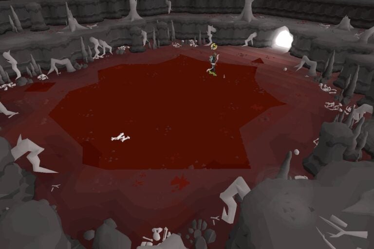 A man stands in a bloody cave.