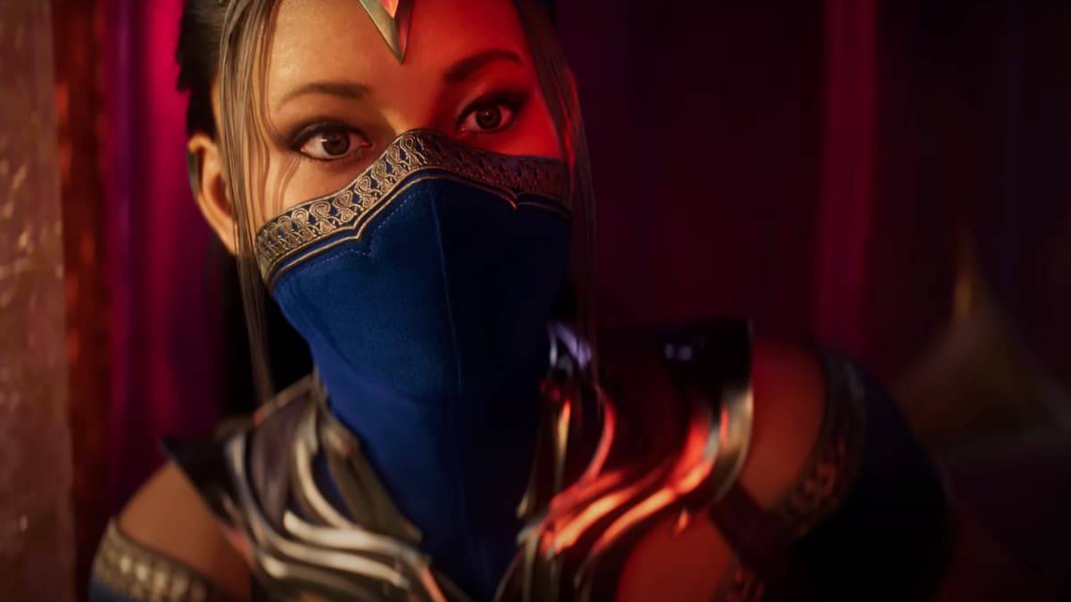 mortal kombat 1 woman with forehead jewel in blue mask and outfit close up in red light