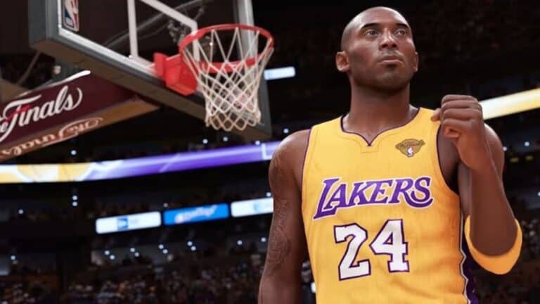 nba 2k24 kobe bryant in lakers gold jersey pumps fist by on courrt by basketball hoop